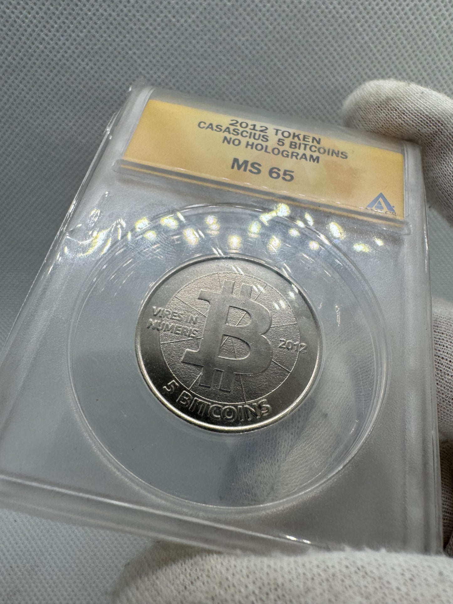 2012 Casascius “Bitnickel” • 5 Bitcoin • sin holograma, sin fondos • ANACS MS-65