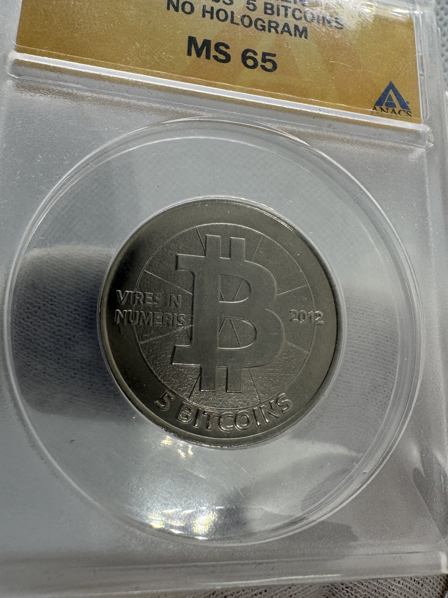 2012 Casascius “Bitnickel” • 5 Bitcoin • sin holograma, sin fondos • ANACS MS-65